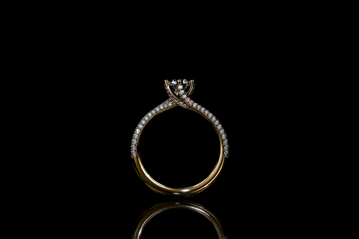 Gold ring with hidden natural diamond melee details on black background